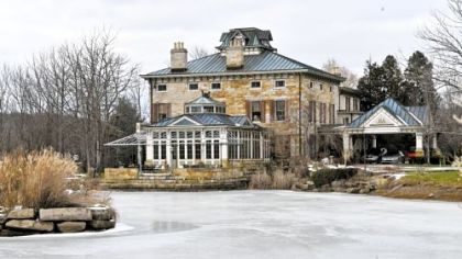 The 11,000 square-foot Riverstone Estate mansion and its south pond.