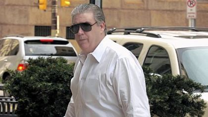 Ed Grattan arrives for a hearing last week at the City-County Building to dispute a $17,569 water bill he received.