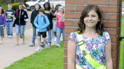 Julia Robb, 11, on patrol duty even with a broken toe at Carnegie Elementary School. The fifth-grader has won the National Safety Patroller of the Year award from the AAA, as noted on the school's announcement board.