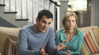 Phil and Claire Dunphy, played by Ty Burrell and Julie Bowen, appear to be talking to a camera crew in "Modern Family."