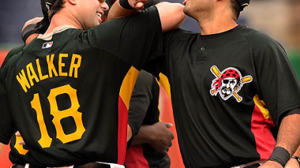 The Pirates' Pedro Alvarez and Neil Walker engage in a secret handshake.