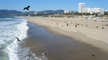 Even on a cool February afternoon, the beach in Santa Monica, California, attracts a few sun-seekers.