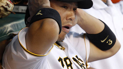 The Pirates' Aki Iwamura sits on the bench.