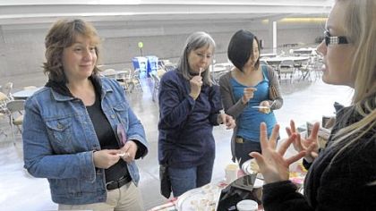 Alice Julier, left, head of Chatham University's new master of arts in food studies program, chats with Amy Soergel of Soergel Orchards at the Farm to Table conference at the David L. Lawrence Convention Center in March.