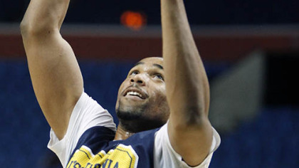 West Virginia's Da'Sean Butler shoots during practice.