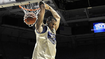 Pitt's Gilbert Brown dunks the ball as his team practices.