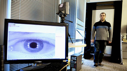 Ramzi Abiantun demonstrates the long-range iris-scanning technology being developed at Carnegie Mellon University's CyLab Biometrics Center. The machine can scan and identify a person from his iris up to 15 meters away.