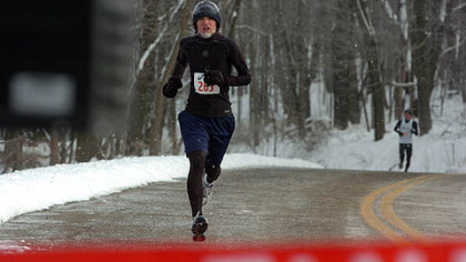 Jacob Morrida, of Clinton, wins the Frigid 5-Miler at North Park.
