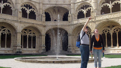 In the cloisters at the Jerónimos Monastery in Lisbon, Portugal, Bill and daughter Rebecca Reed, right, look at a monkey gargoyle mentioned in a well-known guidebook.