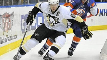 Sidney Crosby scored two goals, his 50th and 51st, in the Penguins' overtime victory Sunday.