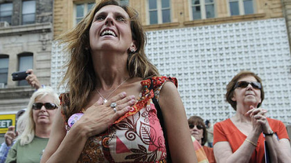 Kristie Tyler, center, of Washington, Pa., attends the Tim Burns rally on Friday.