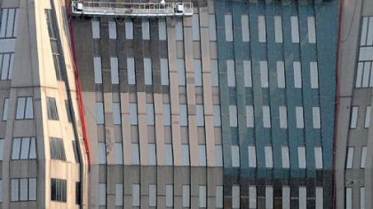 Painters are at work on BNY Mellon Center, Downtown.