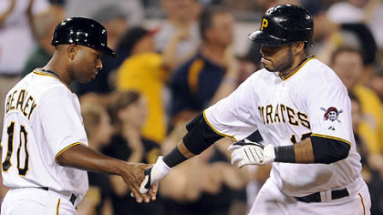 The Pirates' Pedro Alvarez is congratulated by third base coach Tony Beasley after his second home run Wednesday at PNC Park.