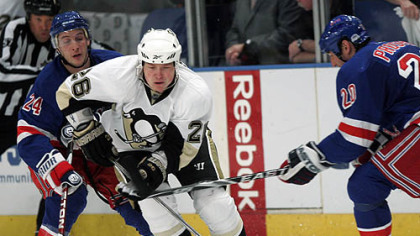 Penguins forward Ruslan Fedotenko skates past Rangers forwards Ryan Callahan and Vaclav Prospal during the third period.