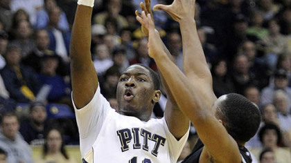 Pitt's Ashton Gibbs puts up a three-point shot against Providence's Sharaud Curry in the first half of Thursday's game at the Petersen Events Center.