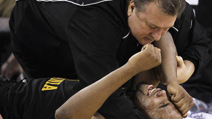 PressWest Virginia head coach Bob Huggins consoles forward DaSean Butler after he was injured during the second half against Duke on Saturday night.