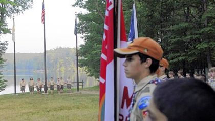 Boy Scouts from Camp Liberty gather for the flag-lowering ceremony.
