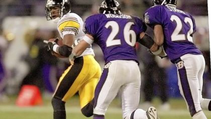 Pittsburgh Steelers wide receiver Bobby Shaw looks back toward Baltimore Ravens safety (and former Steeler legend) Rod Woodson (26) and cornerback Duane Starks after catching a 90-yard touchdown pass from quarterback Kordell Stewart in the fourth quarter in Baltimore, Sunday, Dec. 16, 2001. The Steelers won 26-21.