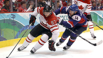 Sidney Crosby controls the puck in front of Slovakia defenseman Andrej Meszaros Friday night.