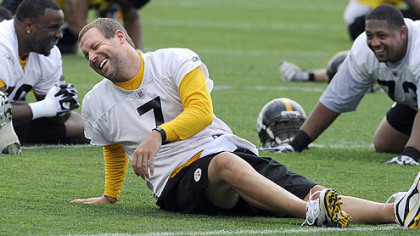 Steelers quarterback Ben Roethlisberger stretches during his first day back to spring practice at the team's South Side facility today.