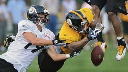 Safety Will Allen, right, breaks up a pass intended for wide receiver Tyler Grisham Tuesday at Saint Vincent College.