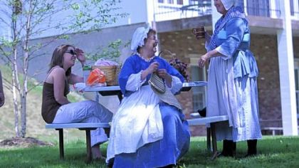 Sharing a laugh at Round Hill Park are, from left, Rachel Briner and her mother Janis Briner, both of Brentwood, and Paula Bowman of Jefferson Hills. Janis Briner and Ms. Bowman, dressed in period costume, are members of the Oliver Miller Homestead Associates from South Park.