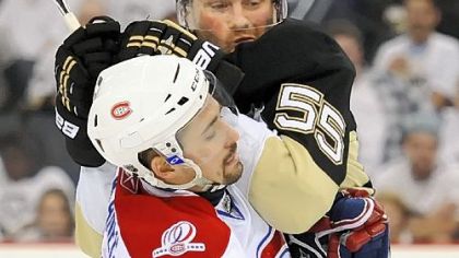 Teams tend to get a feel for each other in Game 1 of a series. Sergei Gonchar roughs up Montreal's Tomas Plekanec in the series opener Friday at Mellon Arena.