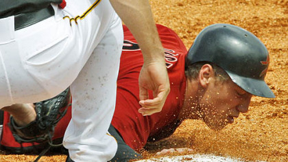 Astros outfielder Hunter Pence gets back to first ahead of the tag by Pirates first baseman Jeff Clement in the third inning.