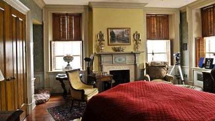 The second-floor master bedroom is fashioned from three rooms. It has painted woodwork, a cherry floor and natural slate hearths, as well as an English coal basket fireplace inserts.