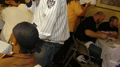 Jerome Bettis shoots video on his camcorder while more than 40 players gathered for dinner Feb. 3, 2006, at the suburban Detroit home of his parents, Johnnie and Gladys. It was the highlight of Bettis' extraordinary Super Bowl week.