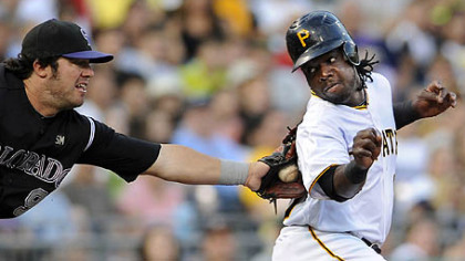 Lastings Milledge is tagged out by Rockies Ian Stewart between second and third base in the second inning Saturday night.