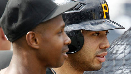 The Pirates' Pedro Alvarez and the White Soxs' Juan Pierre meet during batting practice.