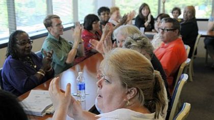 Carolyn Clug, a teacher at Westwood K-8, foreground, and other representatives of the Pittsburgh Federation of Teachers celebrate the contract's ratification Monday.