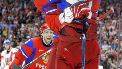 Pavel Datsyuk watches as Alexander Ovechkin congratulates Evgeni Malkin after Malkin scored a goal for Russia in the first period of Sunday's preliminary round game against the Czech Republic.