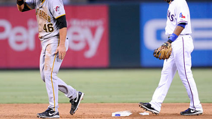 The Pirates' Garrett Jones walks to the dugout after he was caught trying to steal second by the Rangers' Elvis Andrus during the third inning.