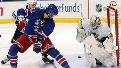 Penguins goaltender Marc-Andre Fleury and defenseman Sergei Gonchar defend the net against Rangers forward Artem Anisimov during the second period.