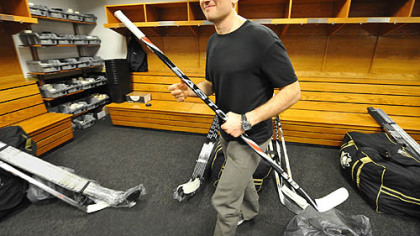 Sergei Gonchar heads for the locker room door Friday after packing up his gear at Mellon Arena. With Gonchar a free agent, will it be for the last time?