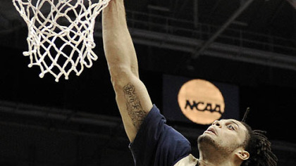 Pitt's Gary McGhee dunks the ball as his team practices.