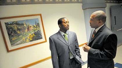 Zane Gates, right, and Deshea Townsend pause in a hallway after a meeting last Monday at Altoona Regional Health System about Dr. Gates' free clinic