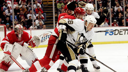 Penguins forward Ruslan Fedotenko is sealed off from the Red Wings goaltender Jimmy Howard during the first period.