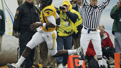 West Virginia quarterback Jarrett Brown scores a first-quarter touchdown against Florida State.