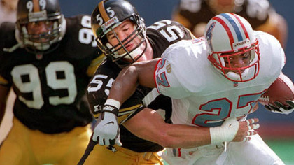 Former Steelers linebacker Jerry Olsavsky tackles former Houston Oilers running back Eddie George in 1996 at Three Rivers Stadium. Olsavsky was hired by the Steelers as linebackers coach.