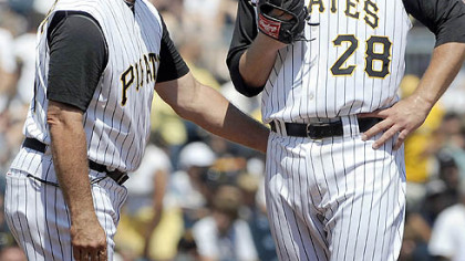 New Pirates pitching coach Ray Searage talks with Paul Maholm in the second inning Sunday at PNC Park. The team fired coach Joe Kerrigan earlier in the day.