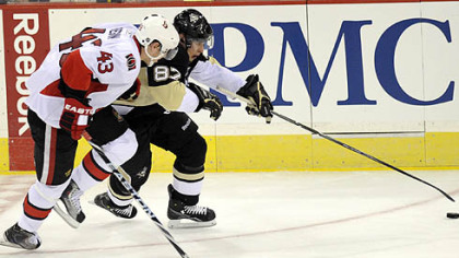 Penguins captain Sidney Crosby tries to work around Senators forward Peter Regin in the second period of Game 1 at Mellon Arena, Wednesday.