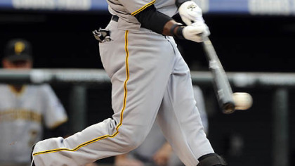 The Pirates' Andrew McCutchen hits a double to lead off the first inning.