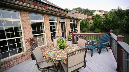 Retractable awnings shade the 20-by-12-foot deck made from Trex, a low-maintenance, composite wood material.