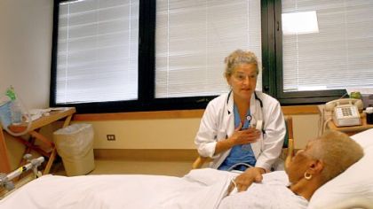 JC McFarland, a registered nurse at Allegheny General Hospital, helps patient Ethel Taylor with calming techniques.
