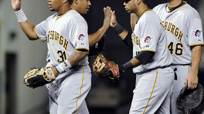 The Pirates' Jose Tabata, Octavio Dotel, Pedro Alvarez and Garrett Jones, from left, congratulate each other after beating the Rockies, 4-2, Tuesday at Coors Field.