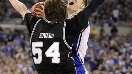 Duke's Miles Plumlee drives to the net agaist Butler's Matt Howard in the first half.