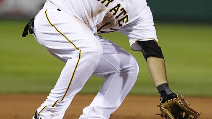 Pirates third baseman Pedro Alvarez can't handle the throw from catcher Ryan Doumit as the White Sox's Juan Pierre steals third in the ninth inning.